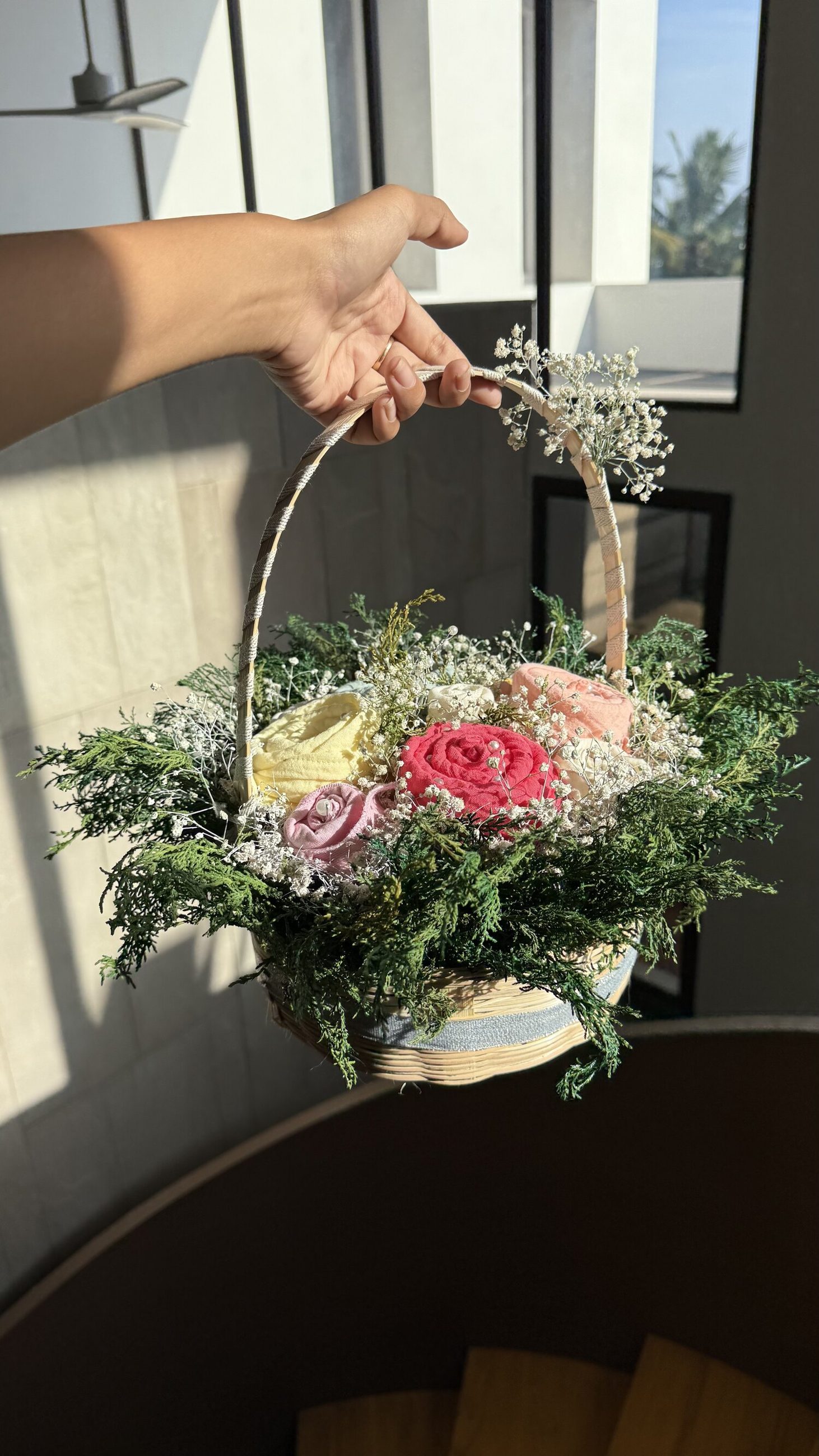 A towel-rose basket, gifted by hand