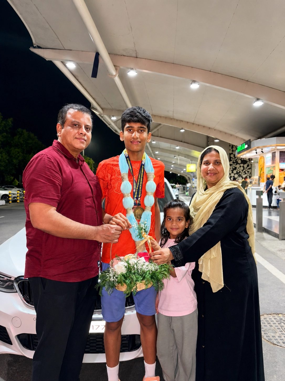 A family honouring their champion son