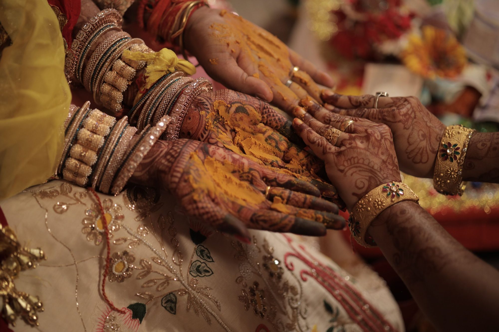 A wedding ceremony, hands joined in blessing